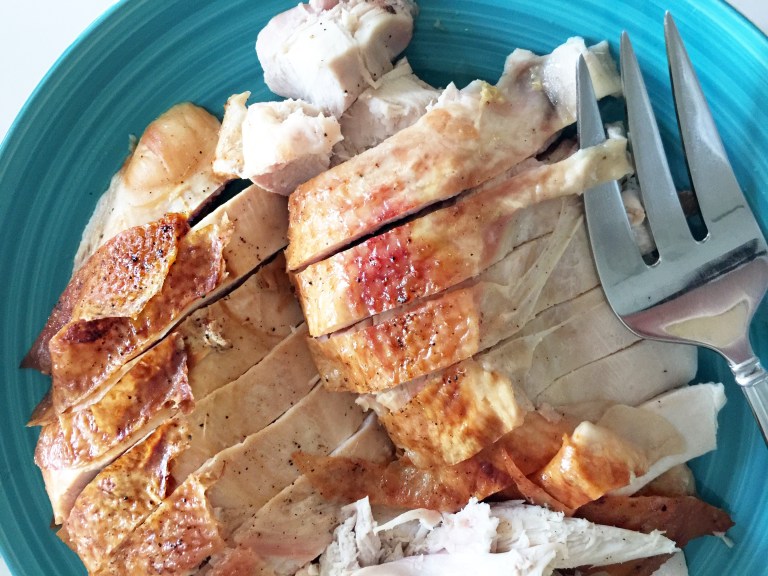 Sliced turkey breast with fork