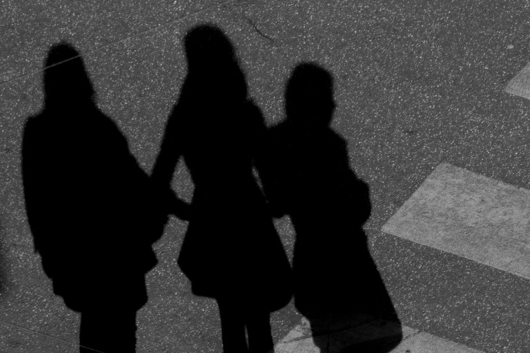 Three women in shadow